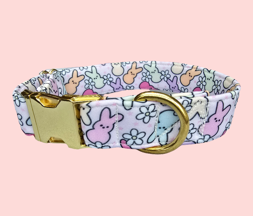 Adjustable neoprene dog collar featuring a pastel Easter Peeps bunny pattern, displayed on a soft faux fur background.