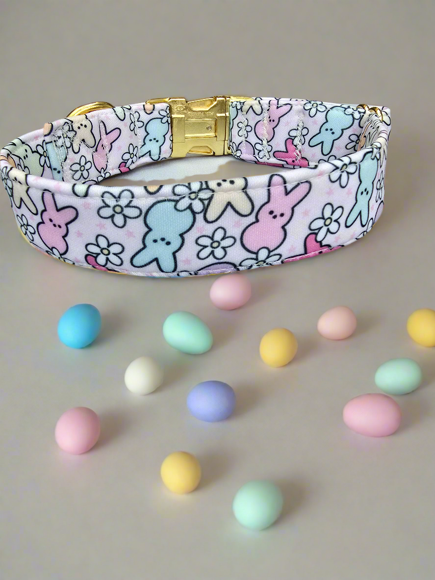 Adjustable neoprene dog collar featuring a pastel Easter Peeps bunny pattern, displayed on a soft faux fur background.