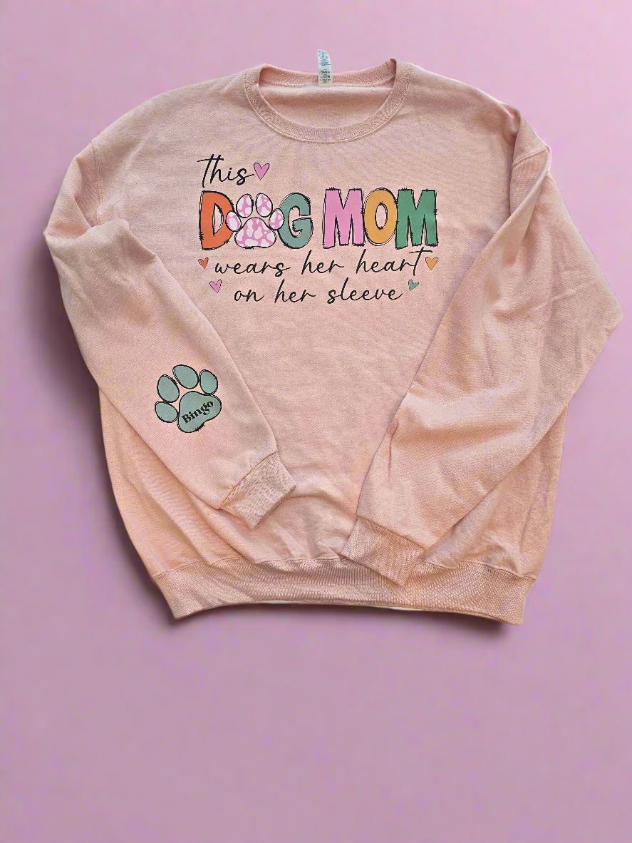 "This Dog Mom Wears Her Heart On Her Sleeve"In BLUSH PINK Personalized Dog Name Sweatshirt in Sweet Cream| Custom Dog Mom Sweatshirt – Personalized Paw Prints & Names