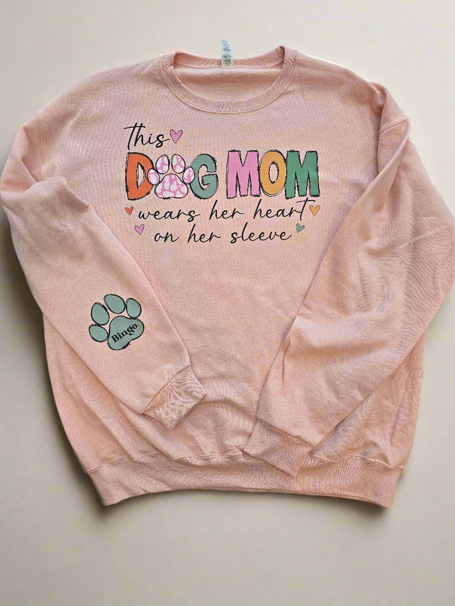 "This Dog Mom Wears Her Heart On Her Sleeve"In BLUSH PINK Personalized Dog Name Sweatshirt in Sweet Cream| Custom Dog Mom Sweatshirt – Personalized Paw Prints & Names