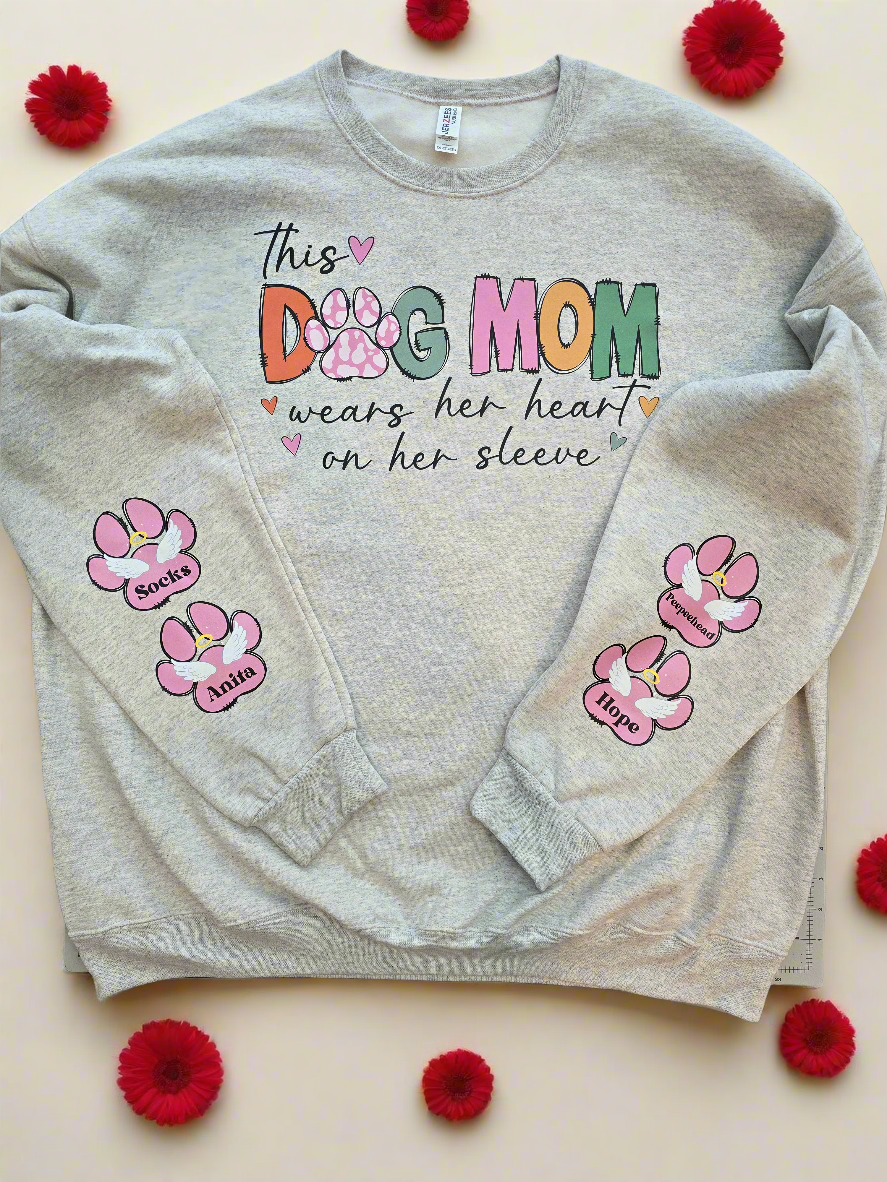 "This Dog Mom Wears Her Heart On Her Sleeve" in Oatmeal Heather Personalized Dog Name Sweatshirt in Oatmeal Heather| Custom Dog Mom Sweatshirt – Personalized Paw Prints & Name