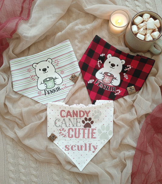 Three dog bandanas with bear designs on a soft fabric background.