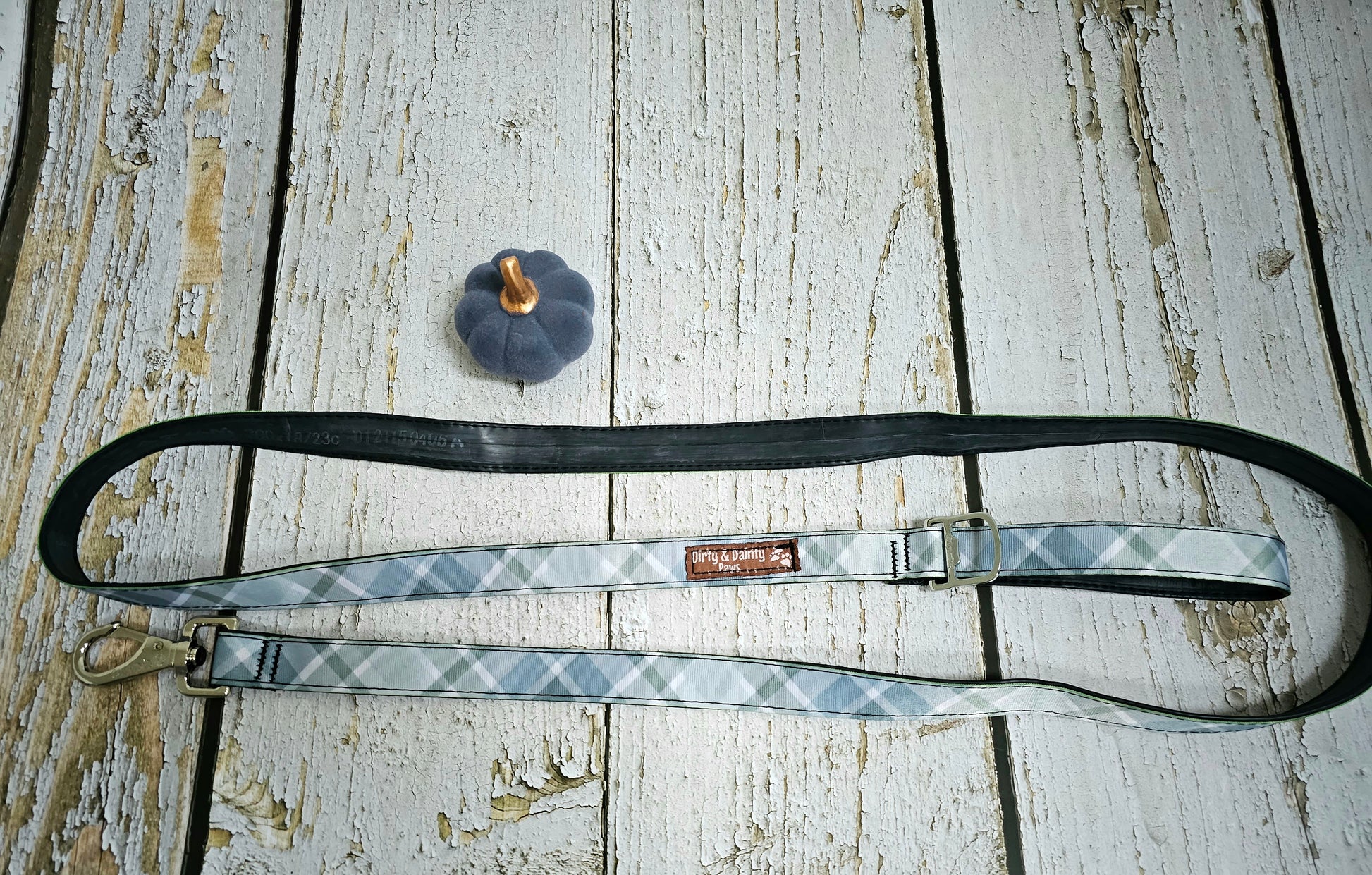 Dirty & Dainty Paws Boho Blue Plaid Dog Leash featuring a stylish plaid pattern, durable metal clasp, and a built-in bottle opener. Made from repurposed bicycle tires.