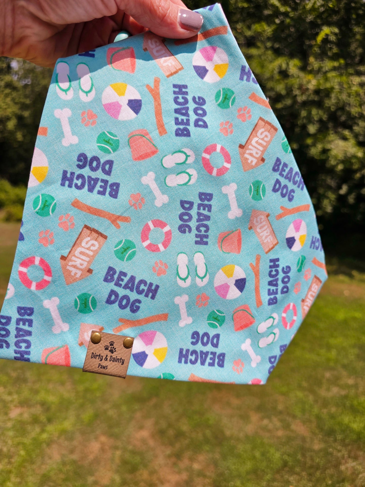 Beach Dog reversible scrunchie bandana with beach-themed design, high-quality materials, and faux leather logo tag, perfect for stylish pups on beach days.