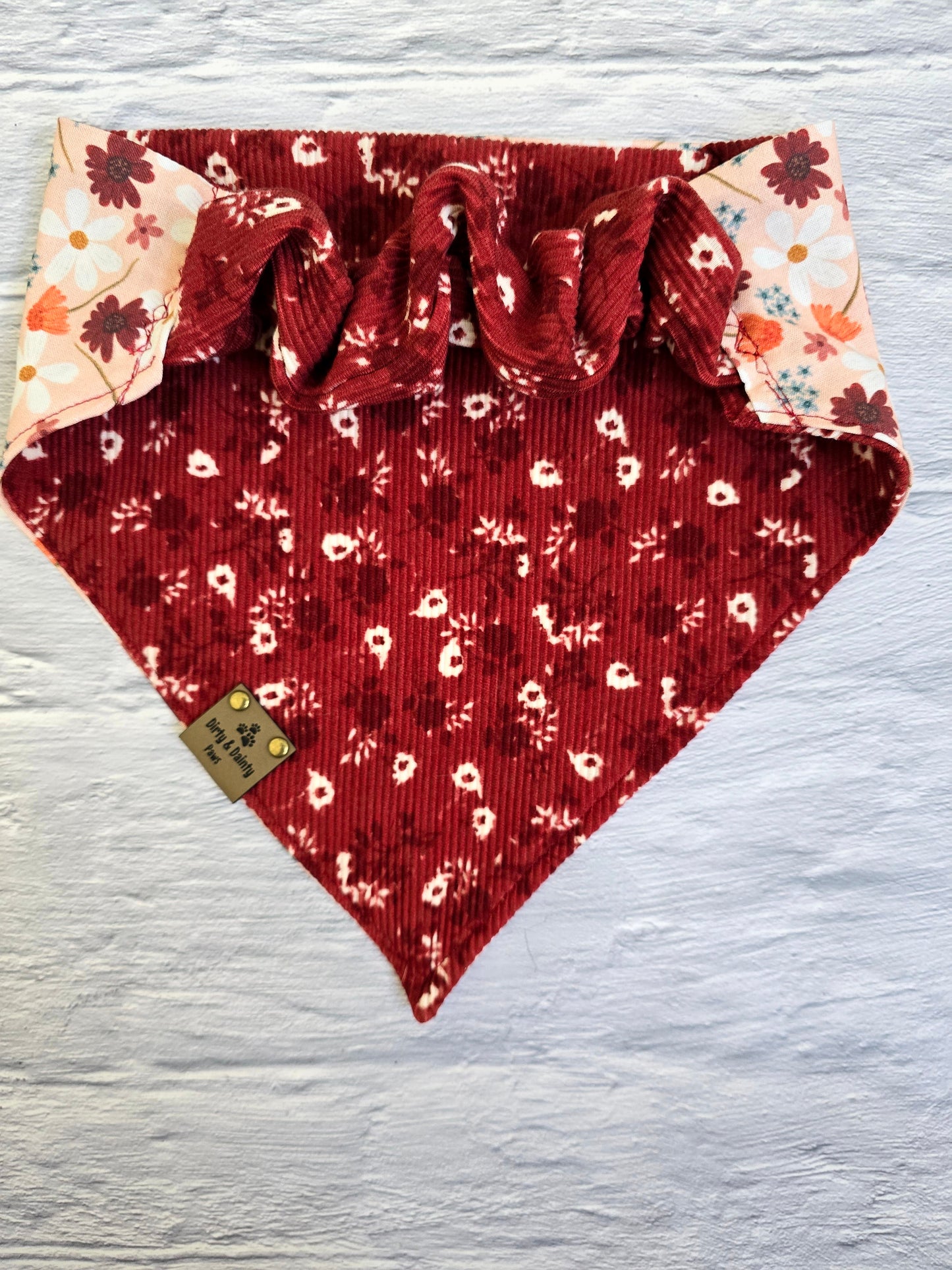 reversible bandana with an Autumn Floral print and a Cozy Floral Ribbed pattern from Dirty and Dainty Paws. Colors pink, Burgundy,  red, orange