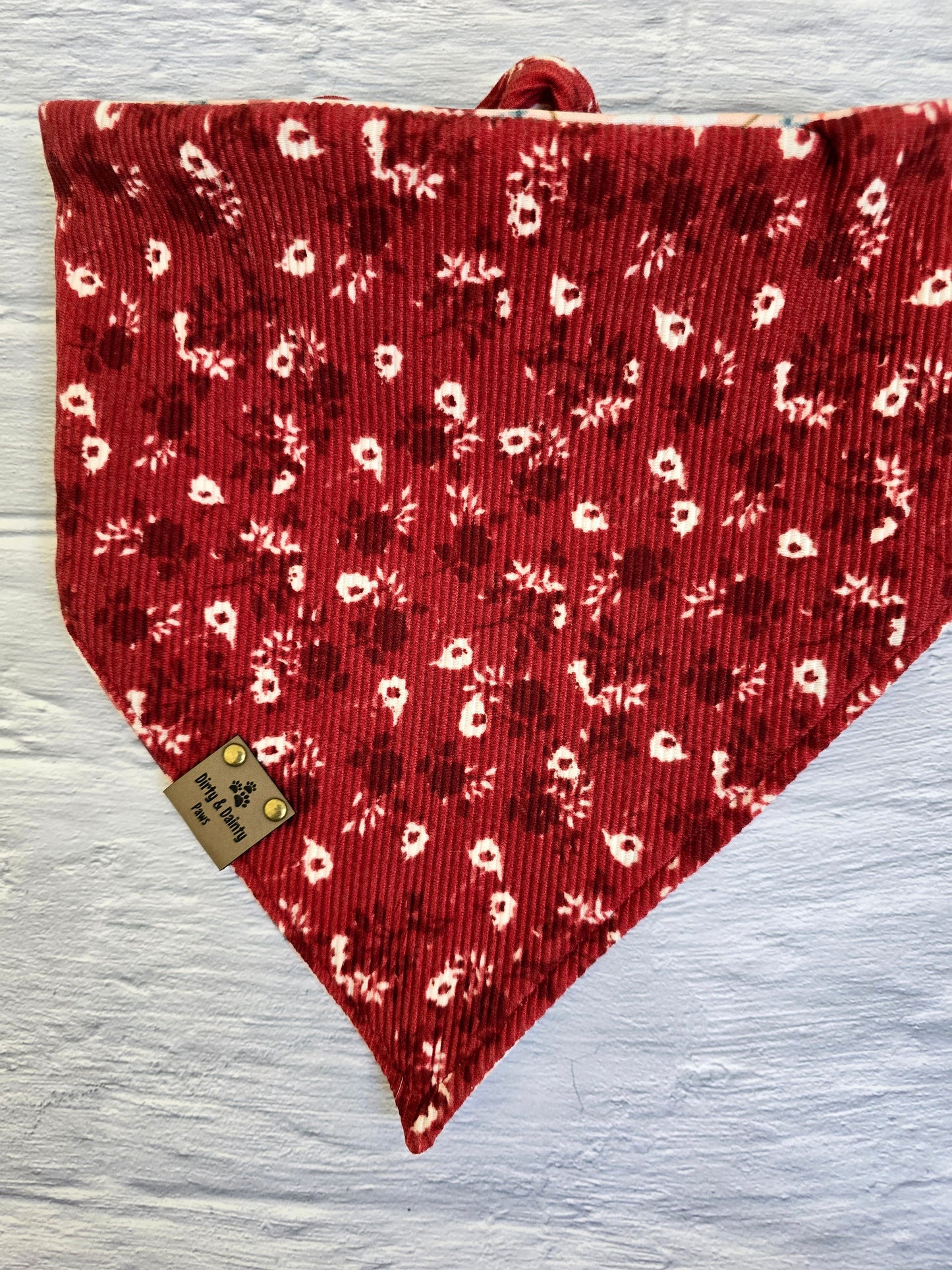 reversible bandana with an Autumn Floral print and a Cozy Floral Ribbed pattern from Dirty and Dainty Paws. Colors pink, Burgundy,  red, orange