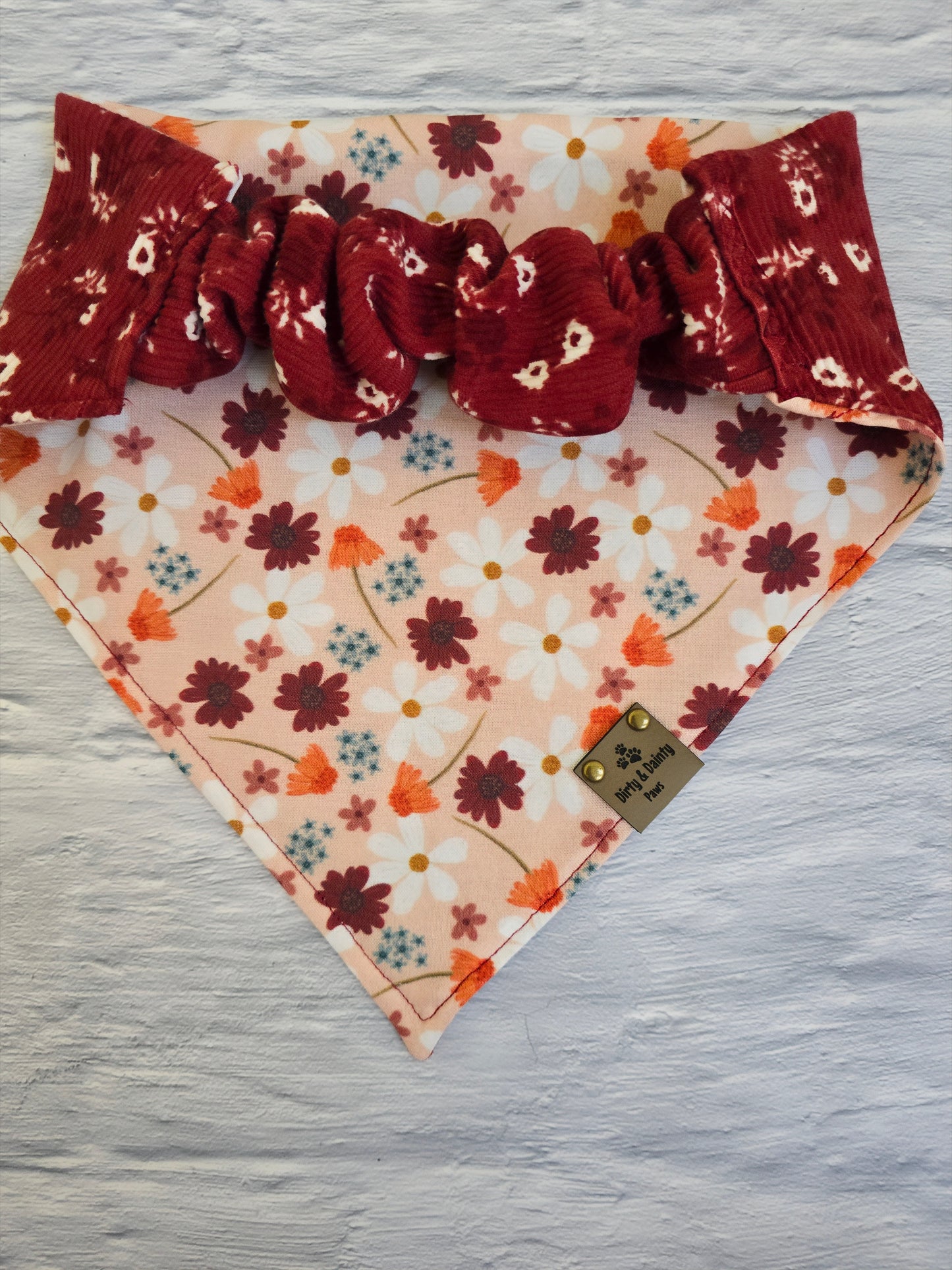 reversible bandana with an Autumn Floral print and a Cozy Floral Ribbed pattern from Dirty and Dainty Paws. Colors pink, Burgundy,  red, orange