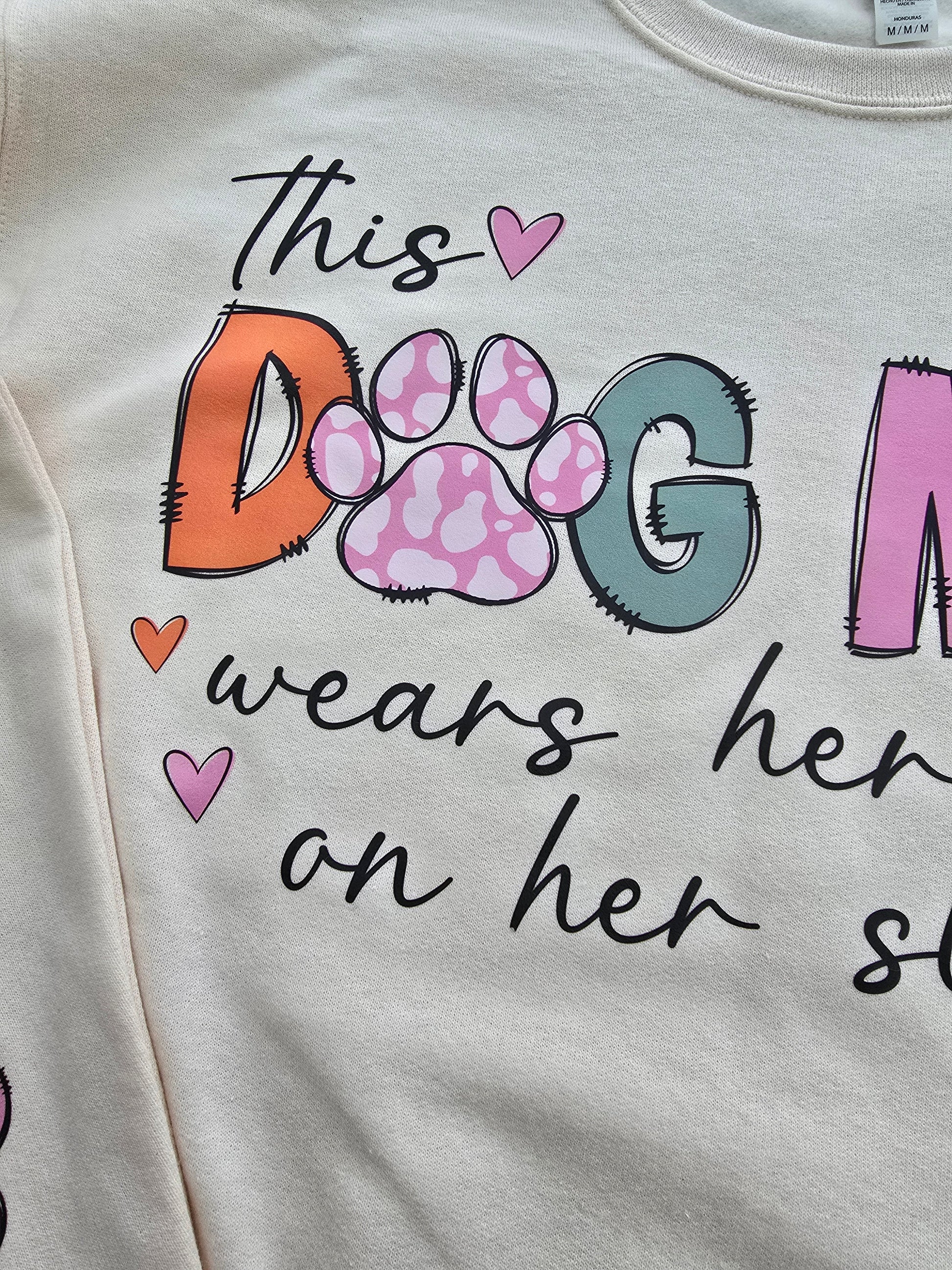 Custom Dog Mom Sweatshirt with "This Dog Mom Wears Her Heart on Her Sleeve" design and personalized paw prints on sleeve