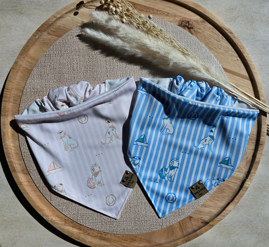 Pink and blue coastal preppy dog bandanas with striped nautical print featuring sailboats, beach balls, and seaside pups. Handmade reversible activewear scrunchie bandanas by Dirty and Dainty Paws