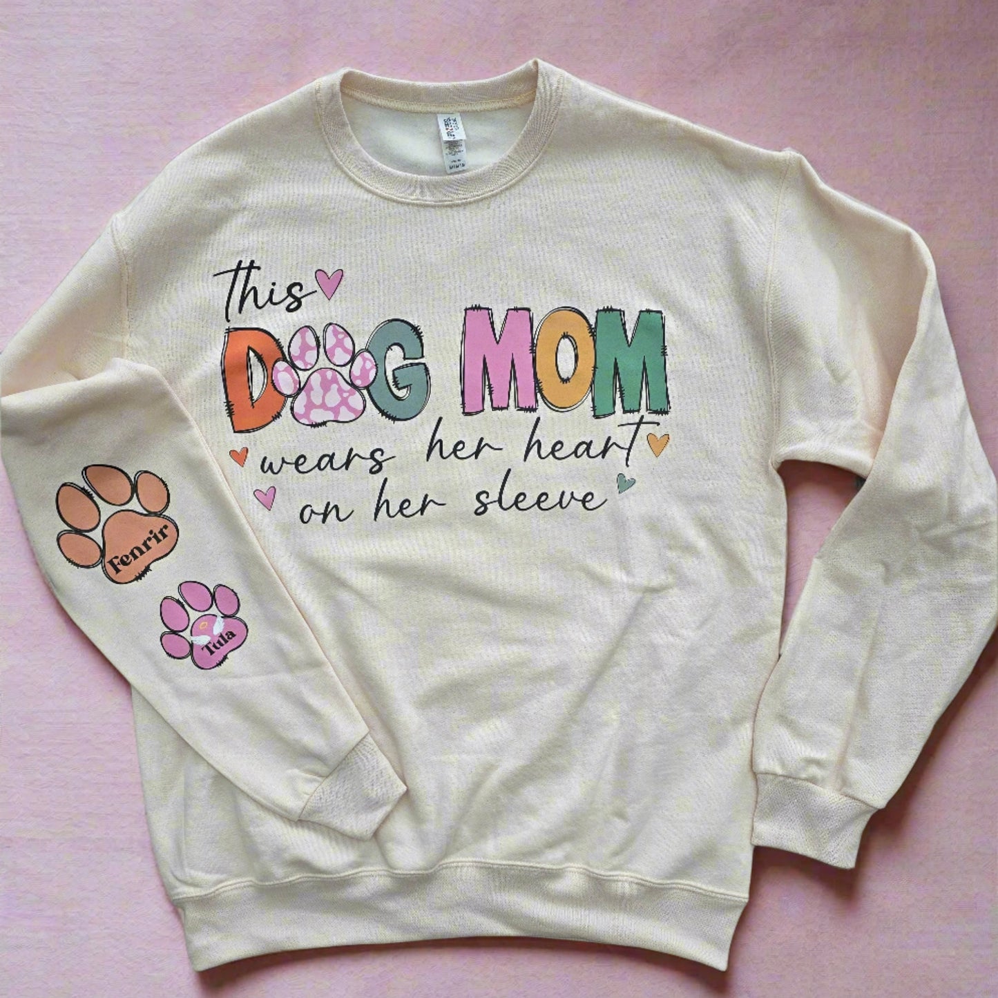 Custom Dog Mom Sweatshirt with "This Dog Mom Wears Her Heart on Her Sleeve" design and personalized paw prints on sleeve