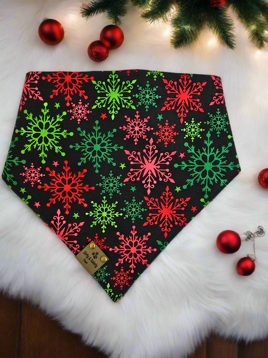 1. Close-up of dog wearing the Christmas Tree / Red & Green Snowflakes reversible scrunchie dog bandana.


2. Christmas tree side of the reversible scrunchie bandana.


3. Red and green snowflake side of the reversible scrunchie bandana.


4. Bandana folded to show both sides of the festive design.


5. Dog wearing the Christmas Tree / Red & Green Snowflakes bandana, showcasing both prints.
