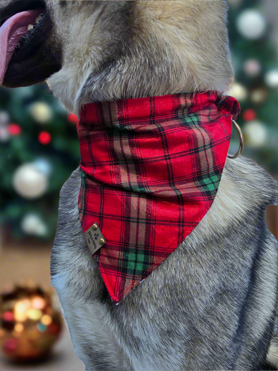 Reversible dog bandana with a "Ghosts of Spooky Christmas" print on one side and a shimmering red plaid design on the other