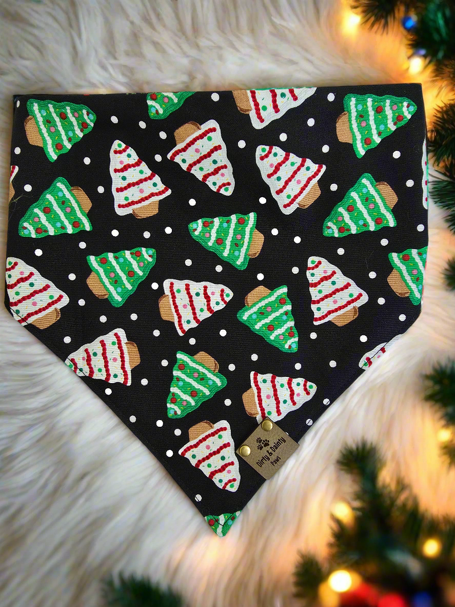 1. Close-up of dog wearing the Christmas Tree / Red & Green Snowflakes reversible scrunchie dog bandana.


2. Christmas tree side of the reversible scrunchie bandana.


3. Red and green snowflake side of the reversible scrunchie bandana.


4. Bandana folded to show both sides of the festive design.


5. Dog wearing the Christmas Tree / Red & Green Snowflakes bandana, showcasing both prints.
