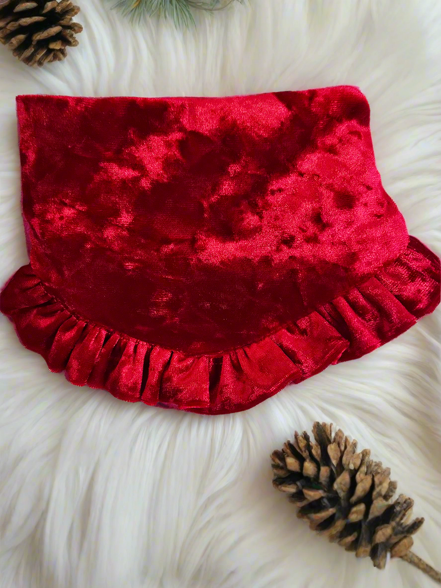  Dog wearing a Pinecone Ruffle Scrunchie Dog Bandana with a pinecone and evergreen design, accented by a red shimmering ruffle trim