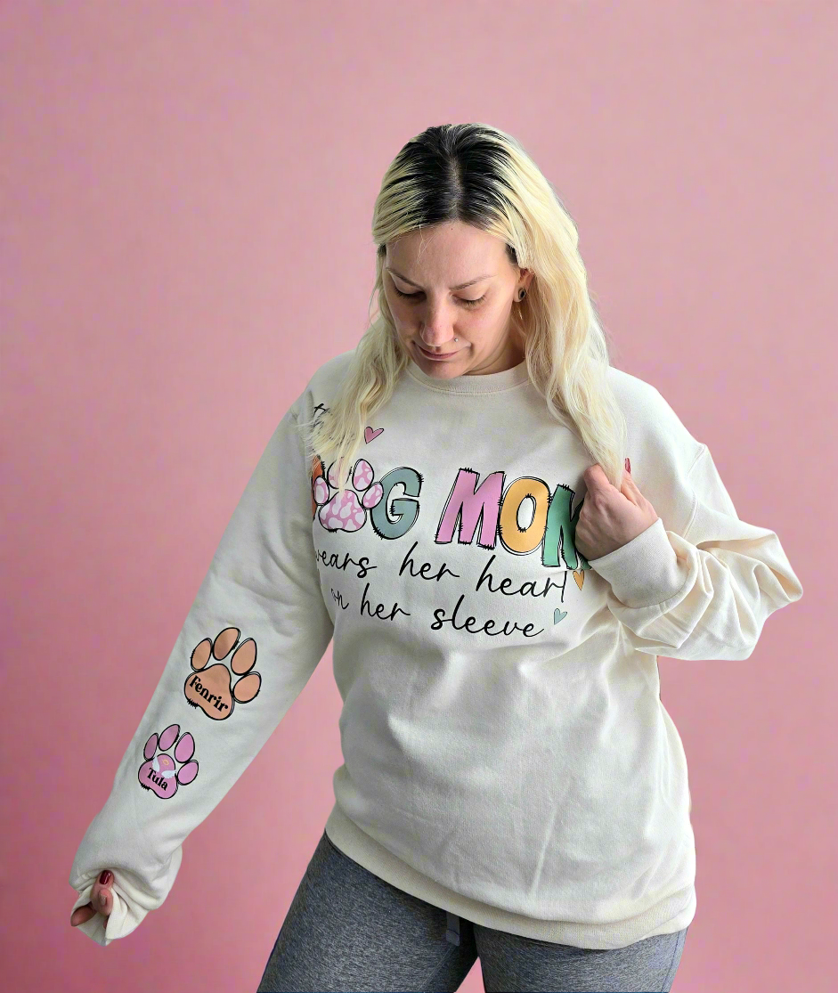 Custom Dog Mom Sweatshirt with "This Dog Mom Wears Her Heart on Her Sleeve" design and personalized paw prints on sleeve