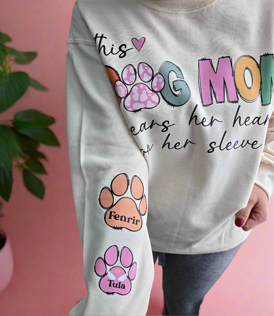 Custom Dog Mom Sweatshirt with "This Dog Mom Wears Her Heart on Her Sleeve" design and personalized paw prints on sleeve