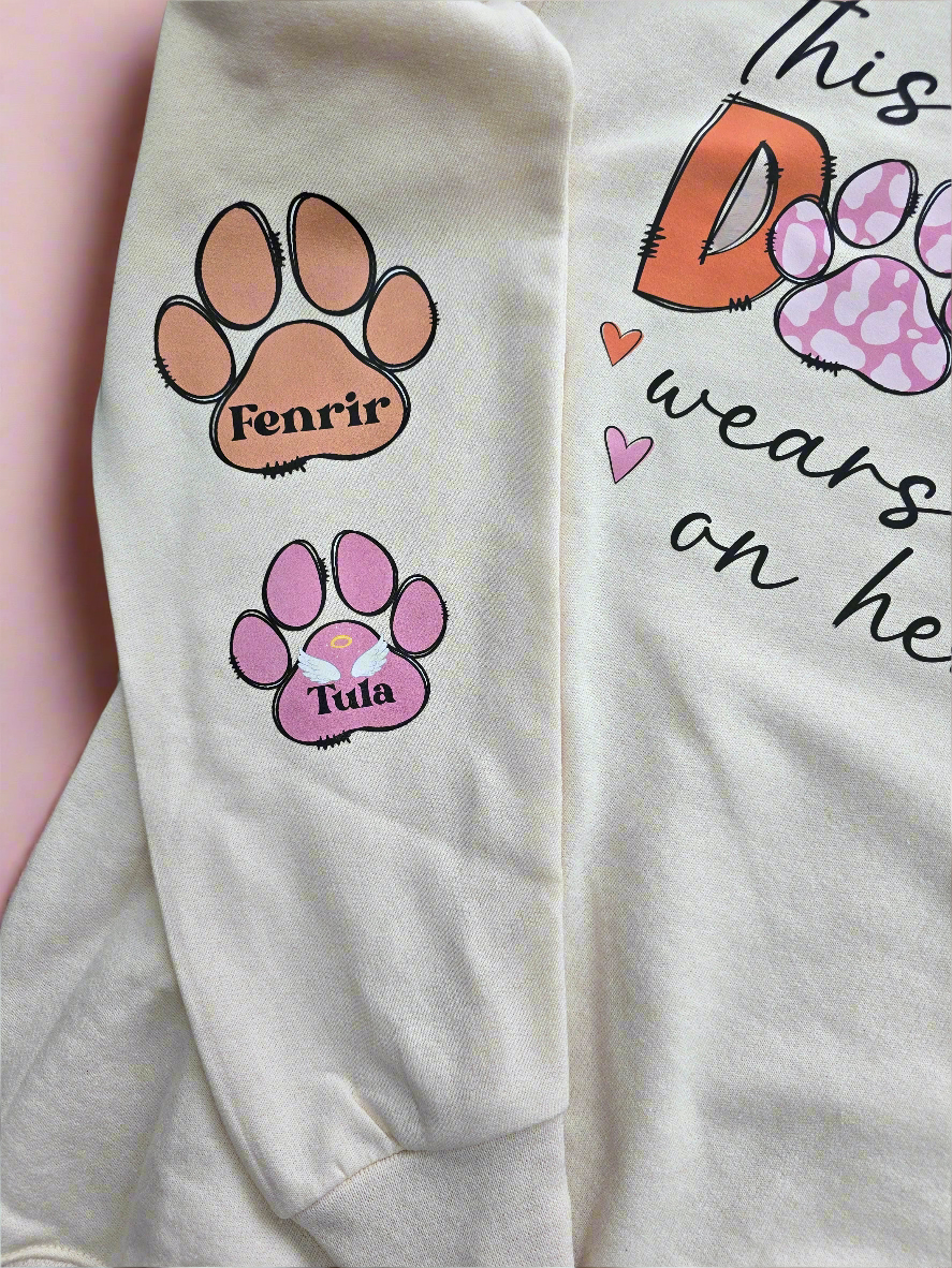 Custom Dog Mom Sweatshirt with "This Dog Mom Wears Her Heart on Her Sleeve" design and personalized paw prints on sleeve