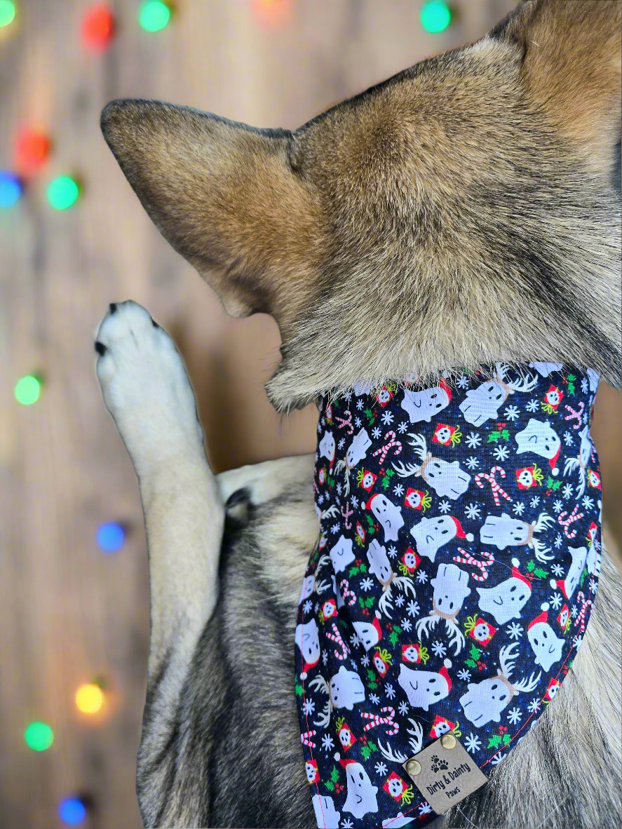 Reversible dog bandana with a "Ghosts of Spooky Christmas" print on one side and a shimmering red plaid design on the other