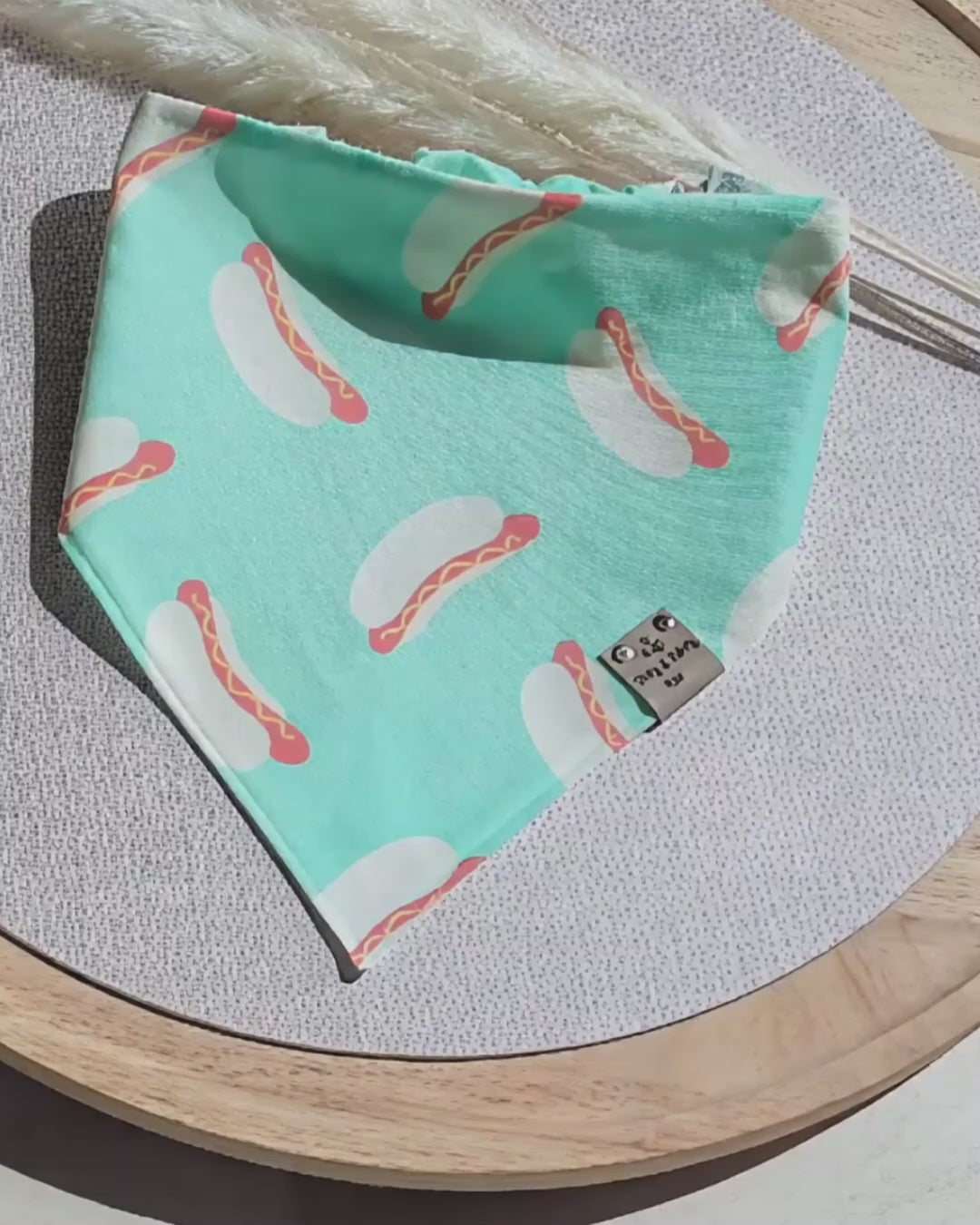 Reversible Cozy Cotton dog bandana featuring a playful hot dog print on mint green fabric with a coordinating mint polka dot reverse side. Handmade scrunchie dog bandana by Dirty and Dainty Paws