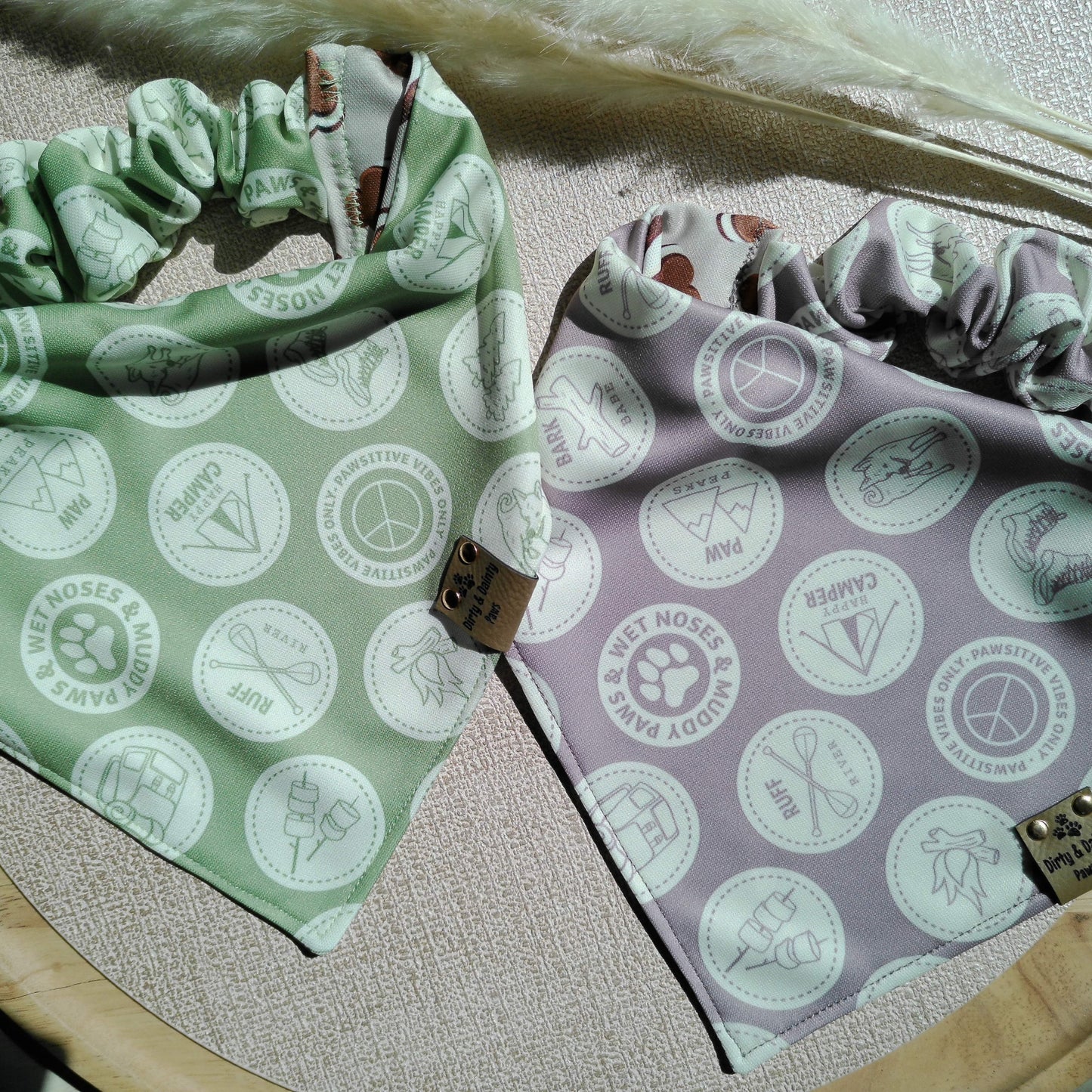 A Sage green and Mauve dog bandana with pup scouts theme and ccamping themes 