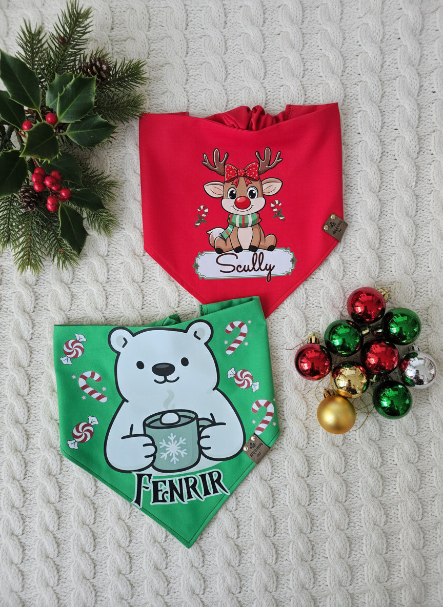 Two dog bandanas with Christmas-themed designs on a textured surface with holiday decorations.