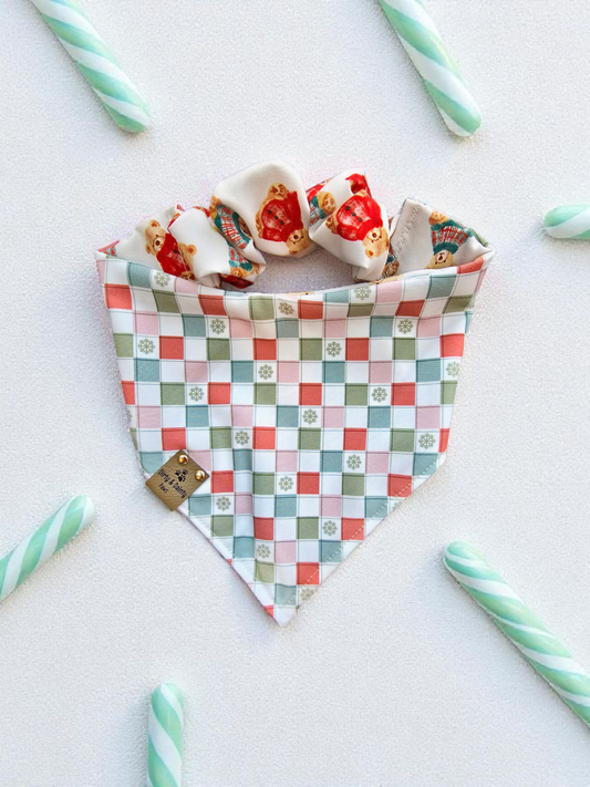 neutral pinks and green plaid with little green snowflakes in the white squares