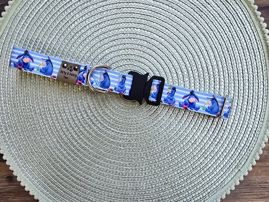 Blue Eeyore nylon dog collar featuring a sewn-on polyester ribbon with Eeyore design and tactical side-release buckle